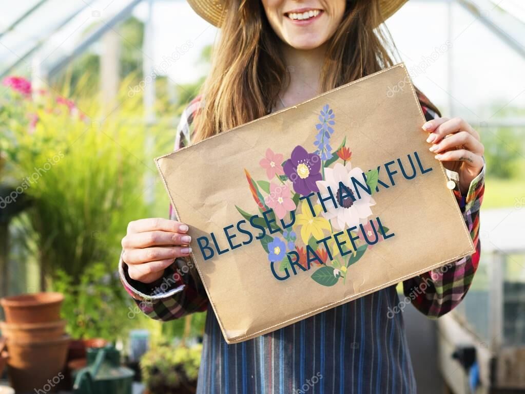 Woman holding Blessed, Thankful, Grateful sign